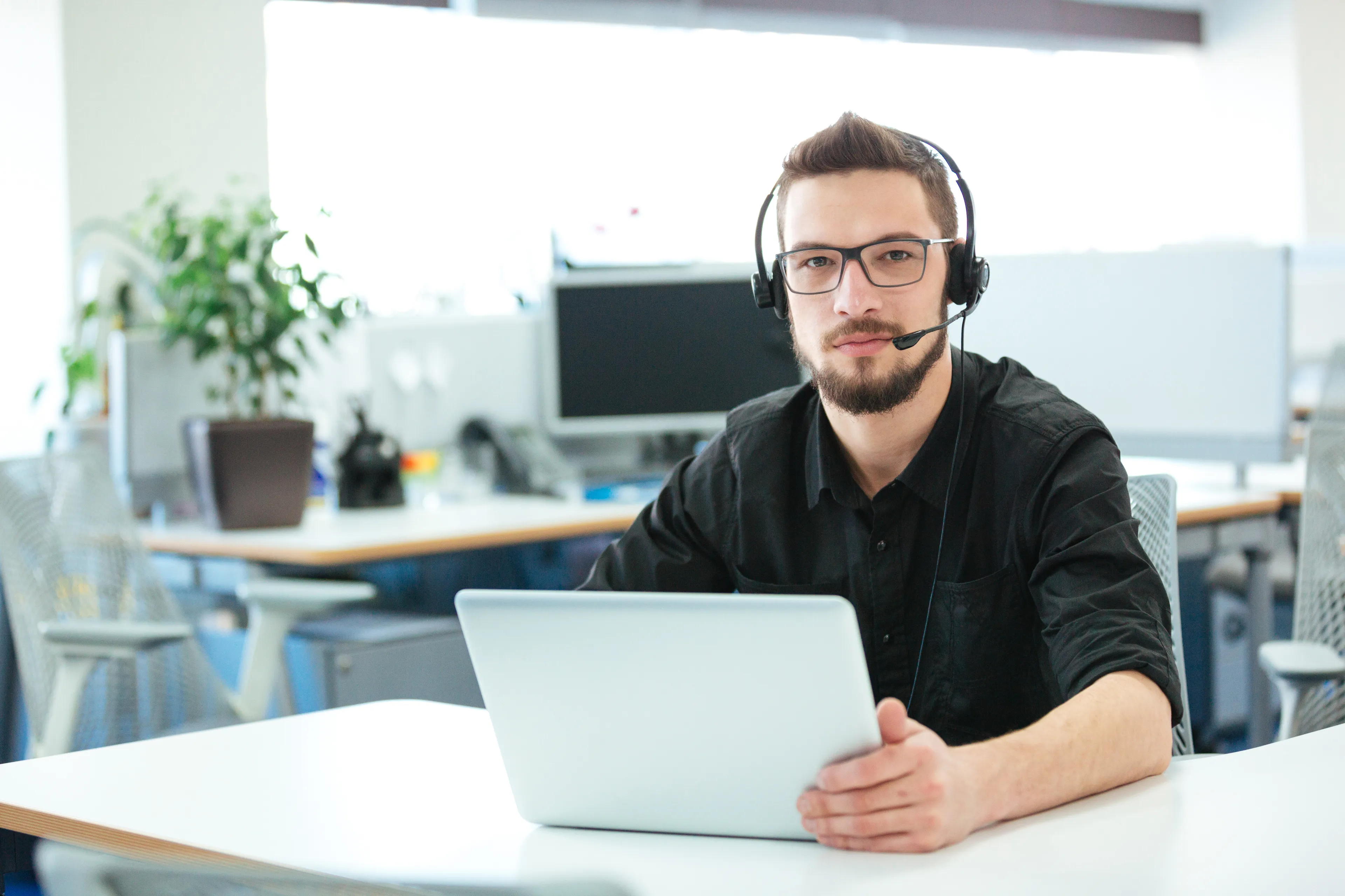 Person at desk with headset