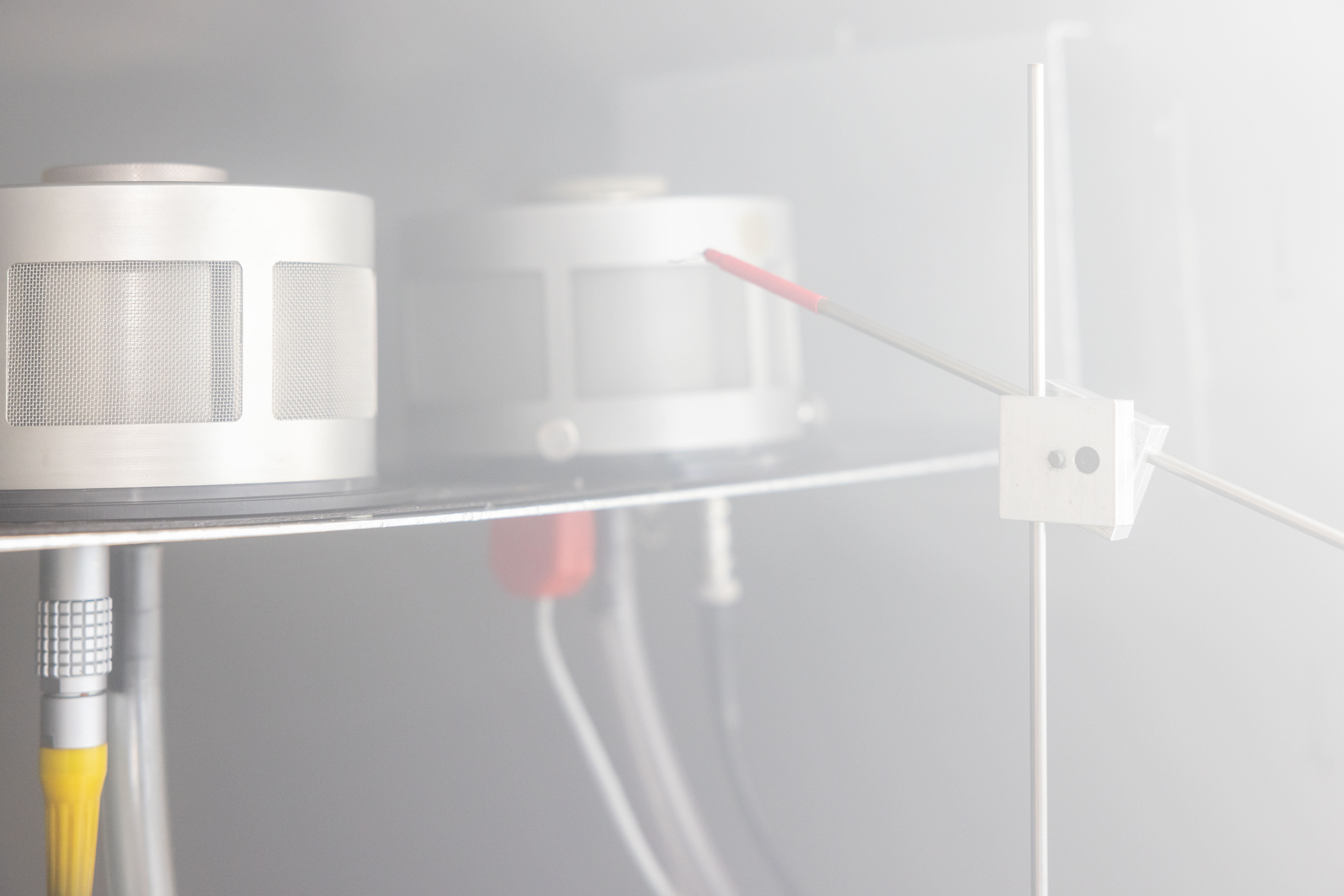 Close-up of MIC smoke measuring instrument with ionisation chamber and probe used for smoke measuring instrument calibration and testing setup.